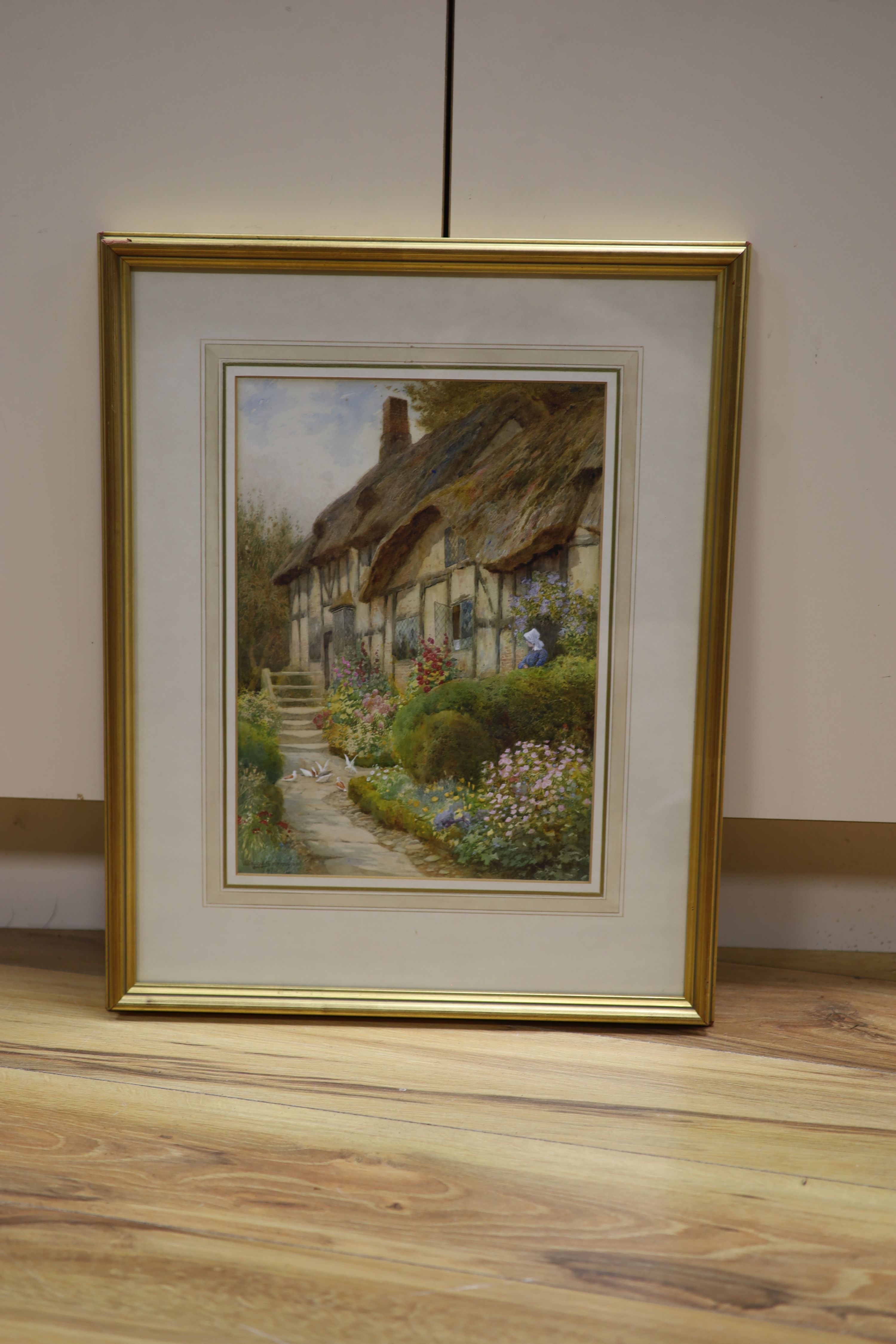 Arthur Claude Strachan, (Scottish, 1865-1938), watercolour, Thatched cottage and garden, Evesham, signed, 36 x 26cm